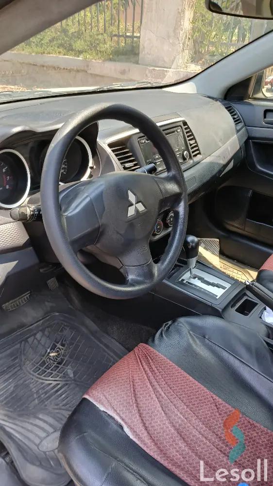 ميتسوبيشي لانسر اوتوماتك مستعملة أبيض موديل 2015 - كل الصور