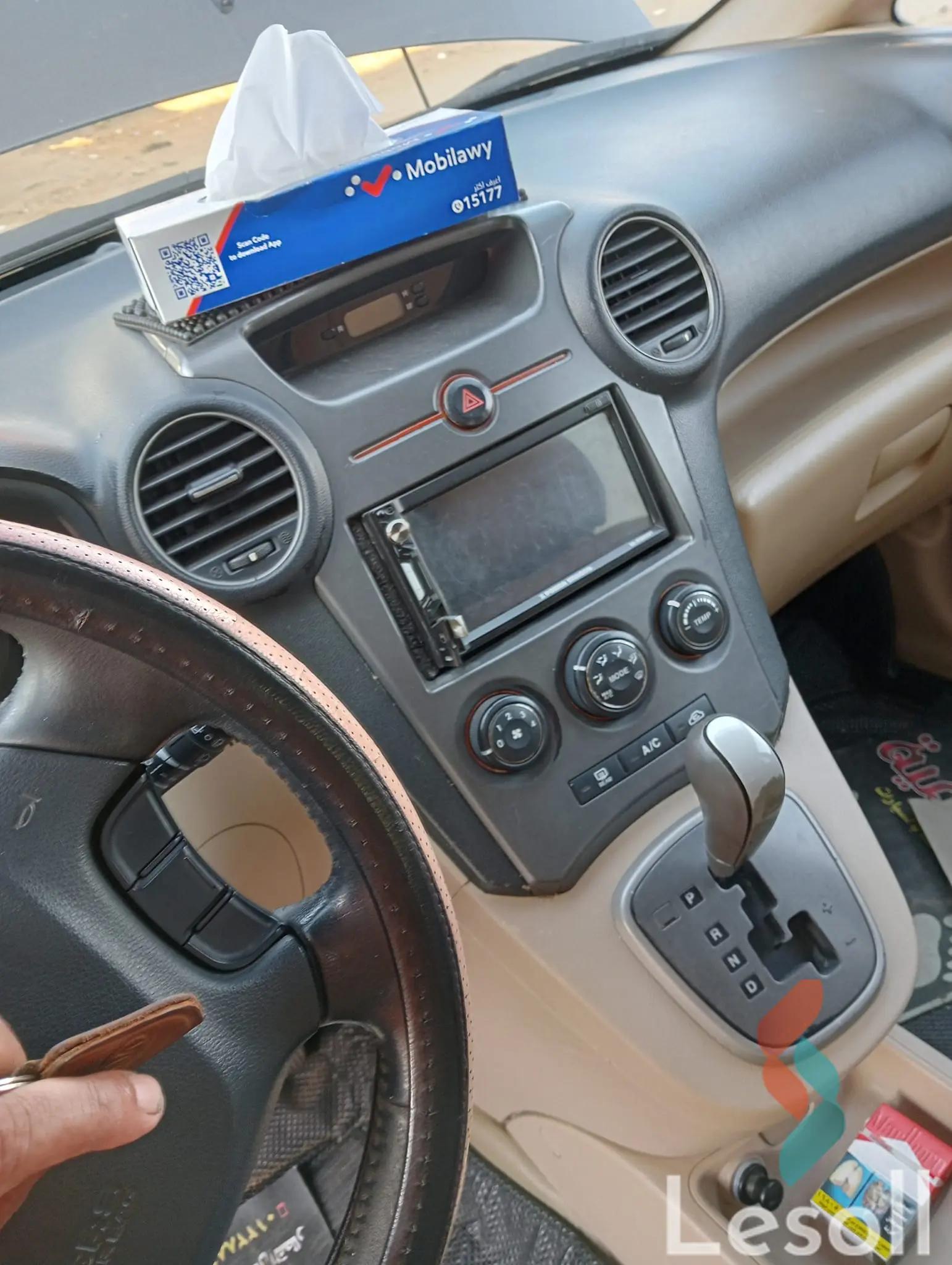 كيا كارينز اوتوماتك جديدة برونزي موديل 2011