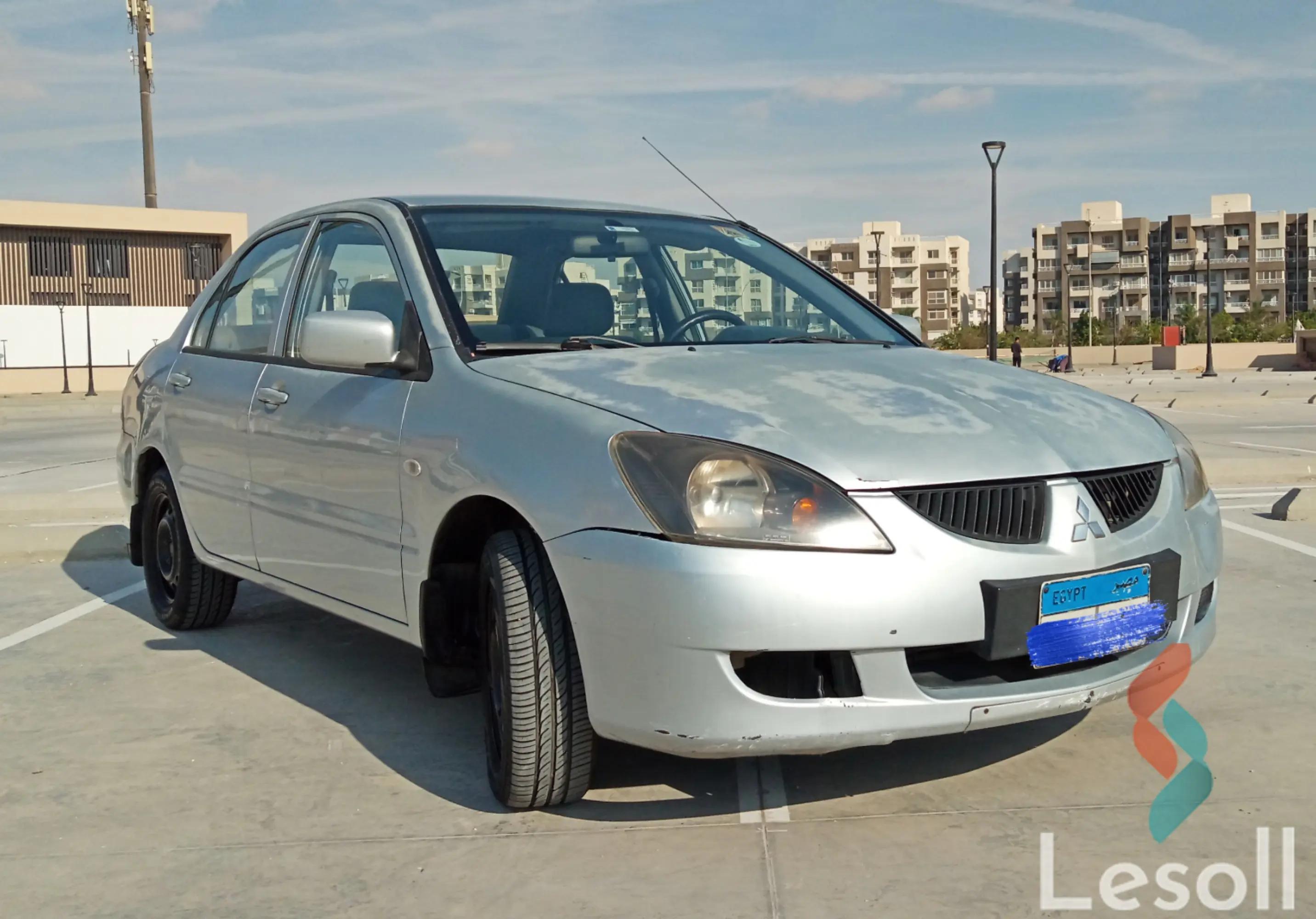 ميتسوبيشي لانسر مانيوال مستعملة فضي موديل 2006