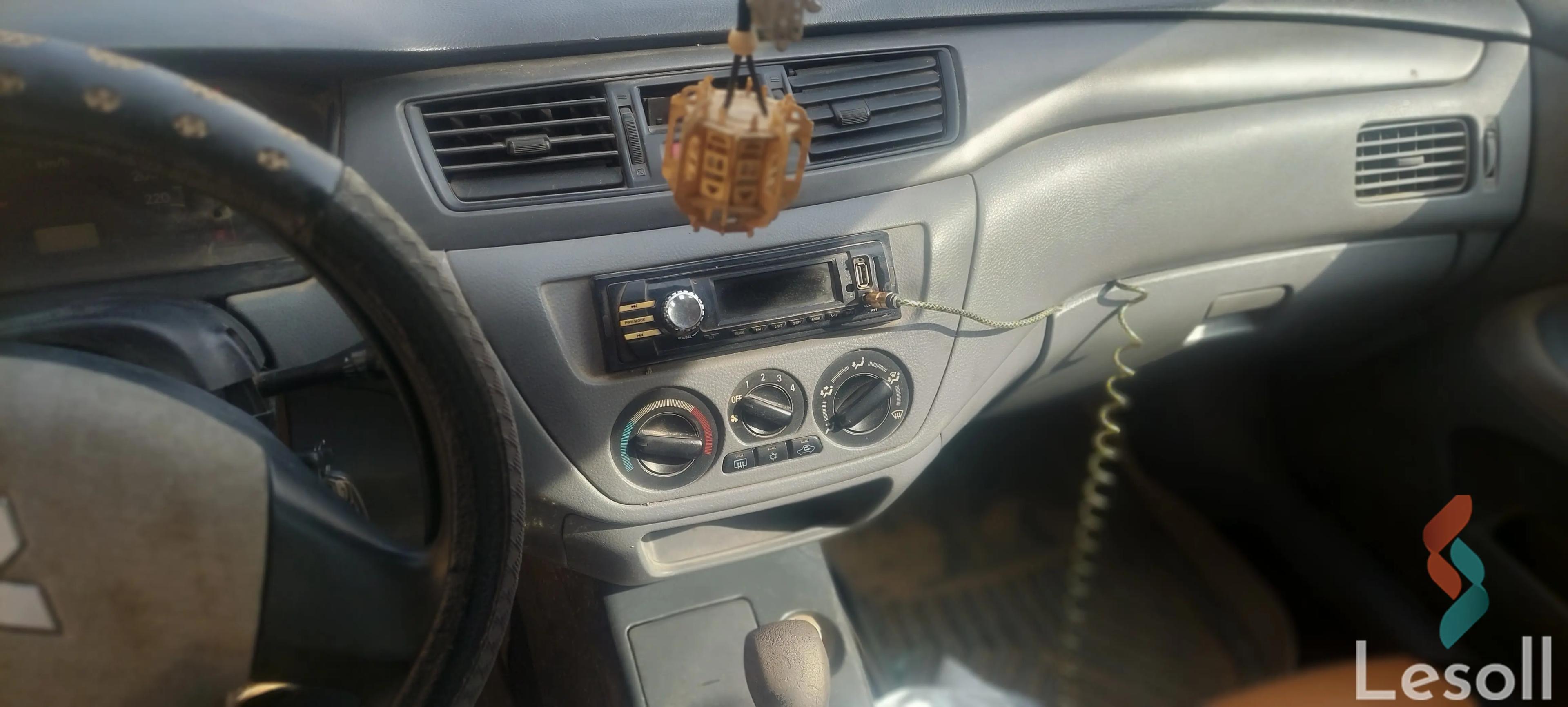 ميتسوبيشي لانسر اوتوماتك مستعملة أبيض موديل 2010