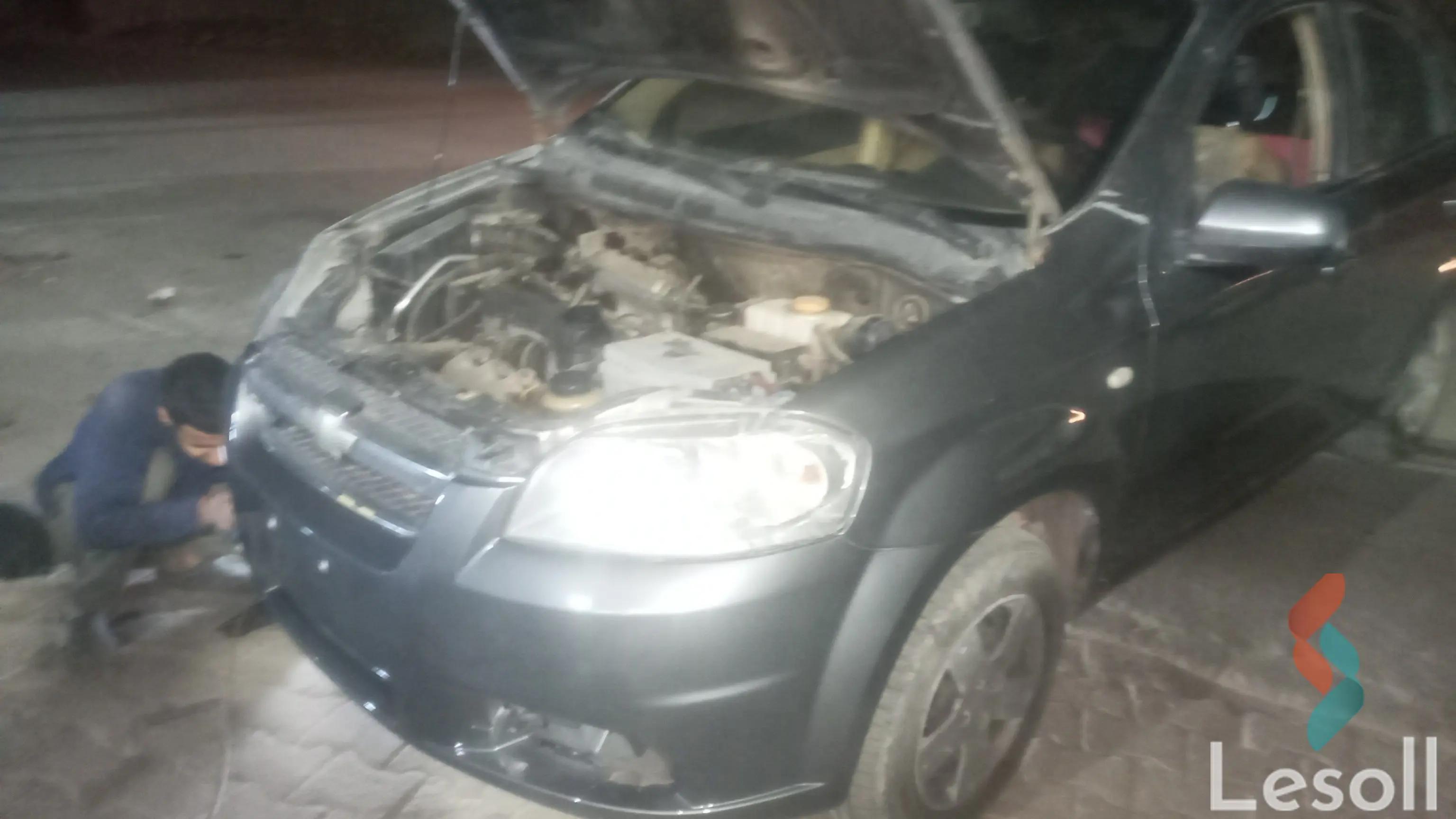 شيفروليه افيو اوتوماتك مستعملة فضي موديل 2010 - كل الصور