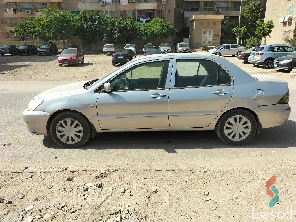 ميتسوبيشي لانسر اوتوماتك مستعملة ذهبي موديل 2014 - صورة 2