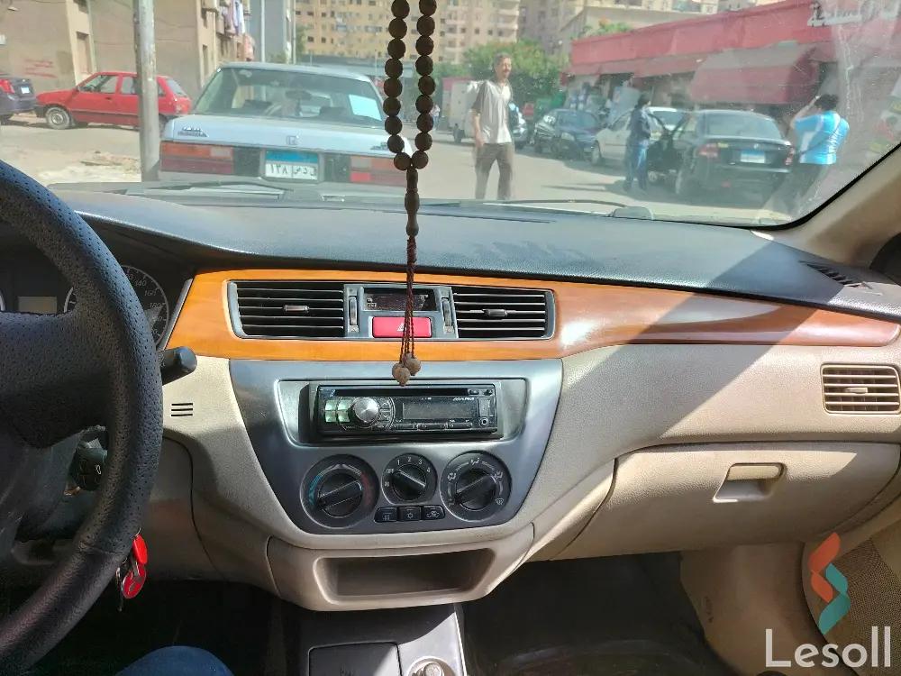 ميتسوبيشي لانسر اوتوماتك مستعملة ذهبي موديل 2014 - كل الصور