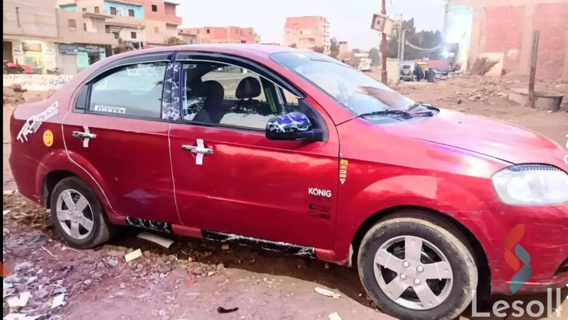 شيفروليه افيو مانيوال مستعملة أحمر موديل 2011 - صورة 3