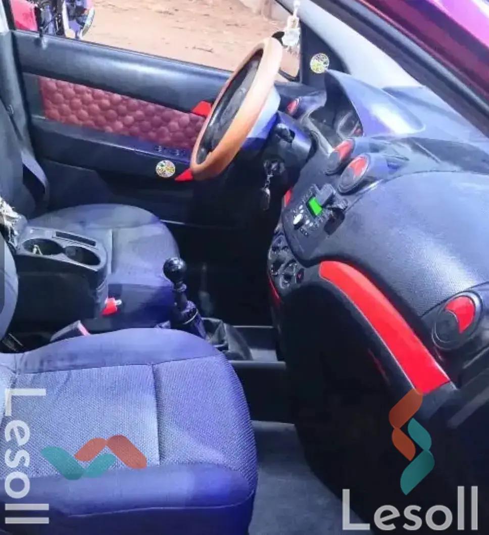 شيفروليه افيو مانيوال مستعملة أحمر موديل 2011 - صورة 4