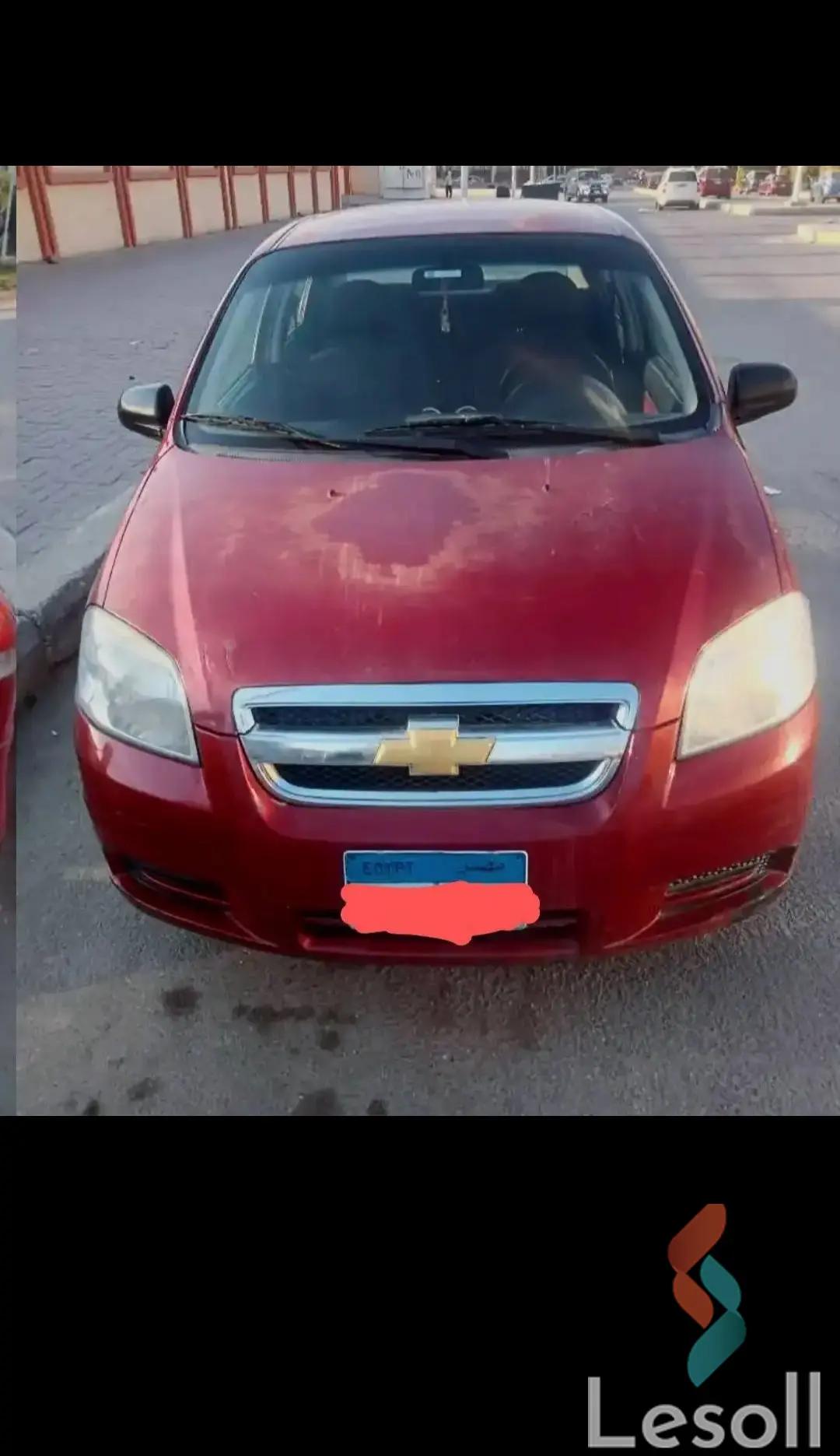 شيفروليه افيو مانيوال مستعملة أحمر موديل 2011 - الصورة الرئيسية