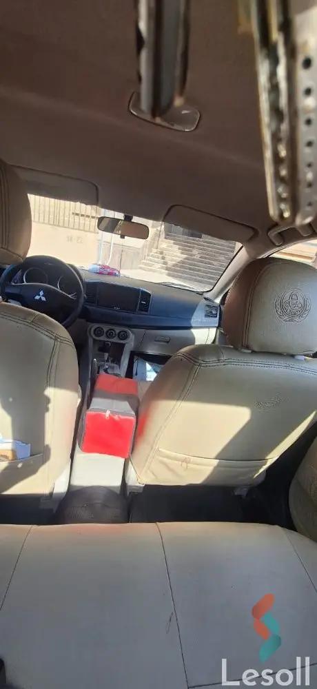 ميتسوبيشي لانسر اوتوماتك مستعملة رمادي داكن موديل 2015