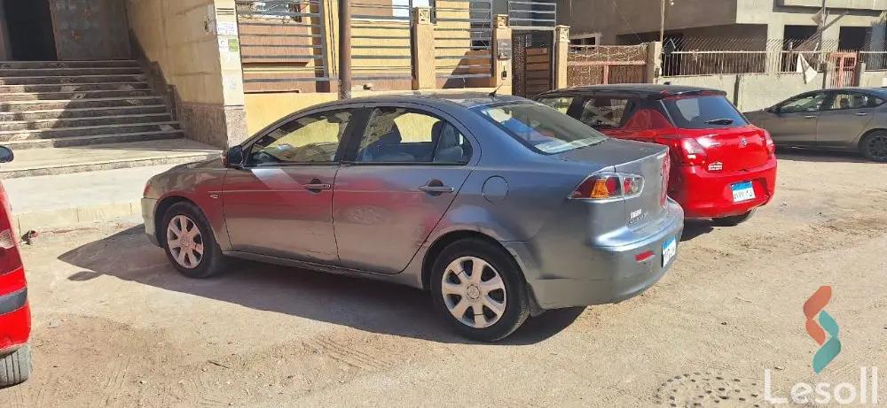 ميتسوبيشي لانسر اوتوماتك مستعملة رمادي داكن موديل 2015