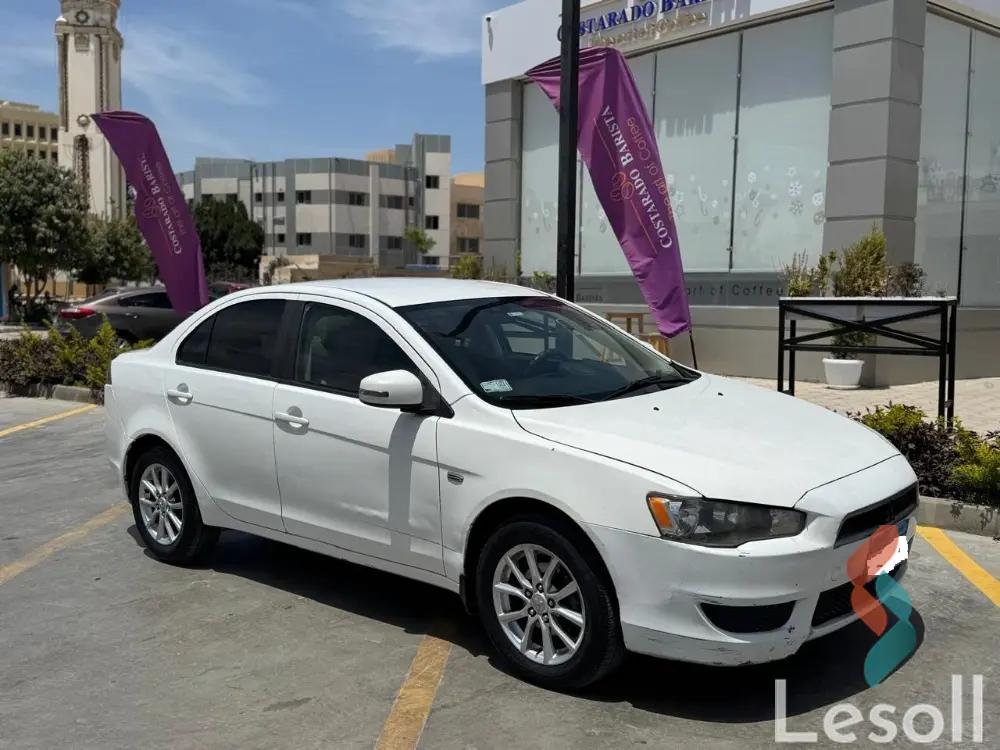 ميتسوبيشي لانسر اوتوماتك مستعملة أبيض موديل 2015 - صورة 2