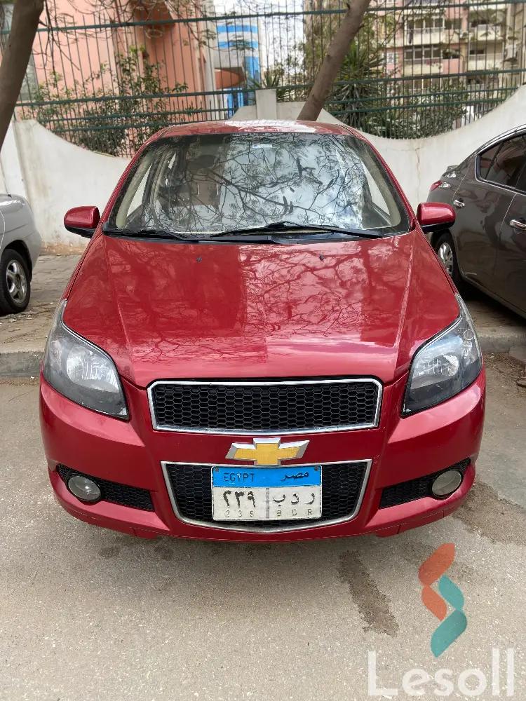 شيفروليه افيو اوتوماتك مستعملة أحمر موديل 2015 - الصورة الرئيسية