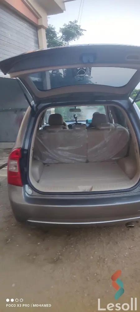 كيا كارينز اوتوماتك مستعملة رمادي داكن موديل 2010