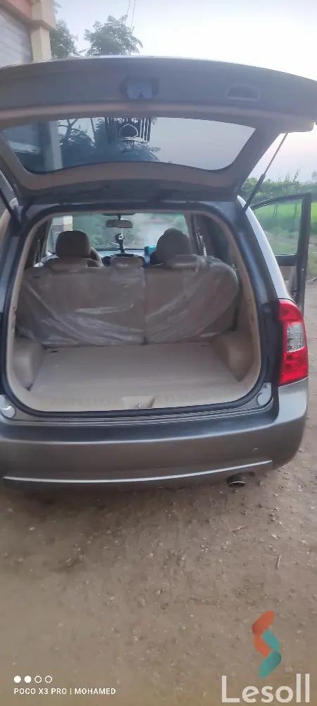 كيا كارينز اوتوماتك مستعملة رمادي داكن موديل 2010