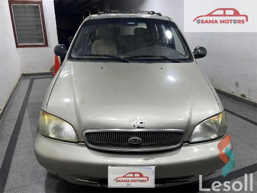 كيا كارنفال اوتوماتك مستعملة ذهبي موديل 1999