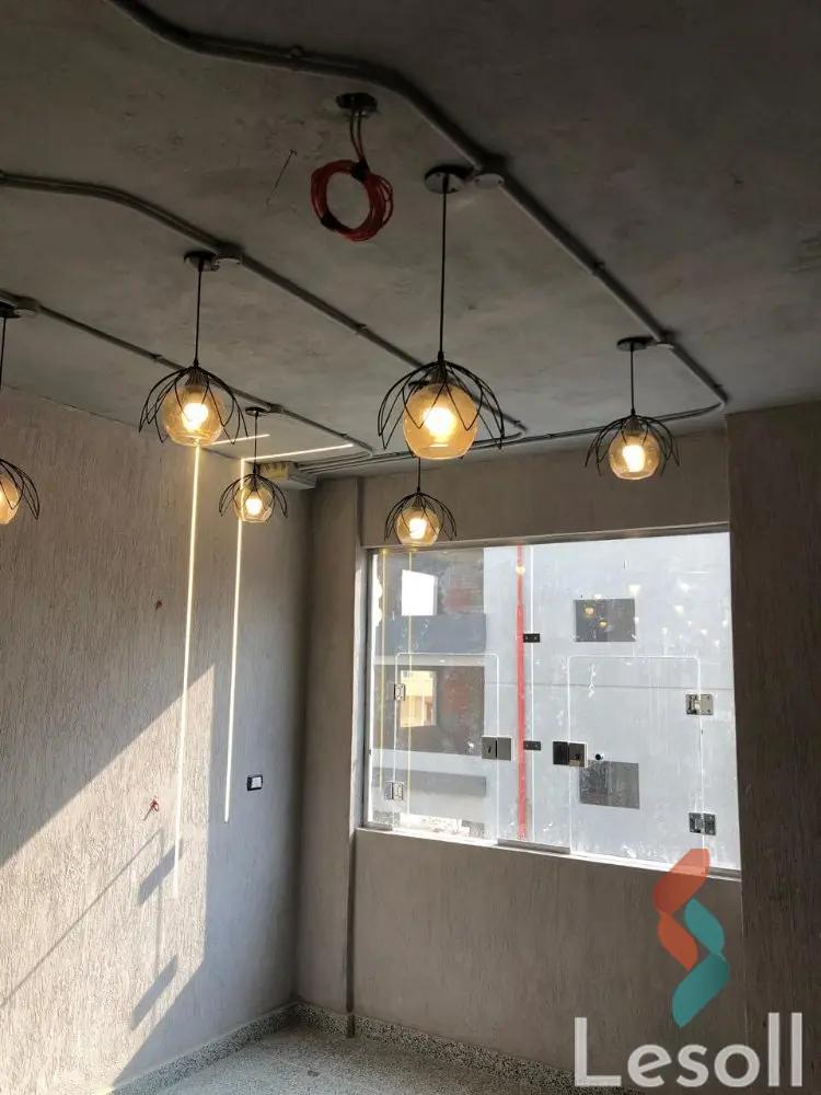 Commercial mall for sale, 1125 square meters, currently leased, located in Palm Villa Compound, behind Mall of Egypt, October City, offered at a competitive price. - All Images