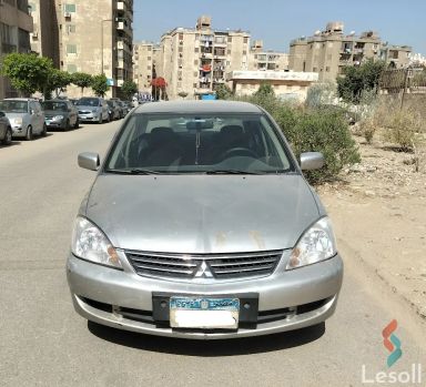 ميتسوبيشي لانسر اوتوماتك مستعملة ذهبي موديل 2014