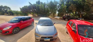 ميتسوبيشي لانسر اوتوماتك مستعملة رمادي داكن موديل 2015