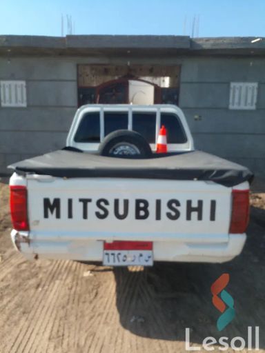 ميتسوبيشي لانسر مانيوال مستعملة أبيض موديل 2003