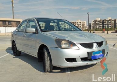 ميتسوبيشي لانسر مانيوال مستعملة فضي موديل 2006