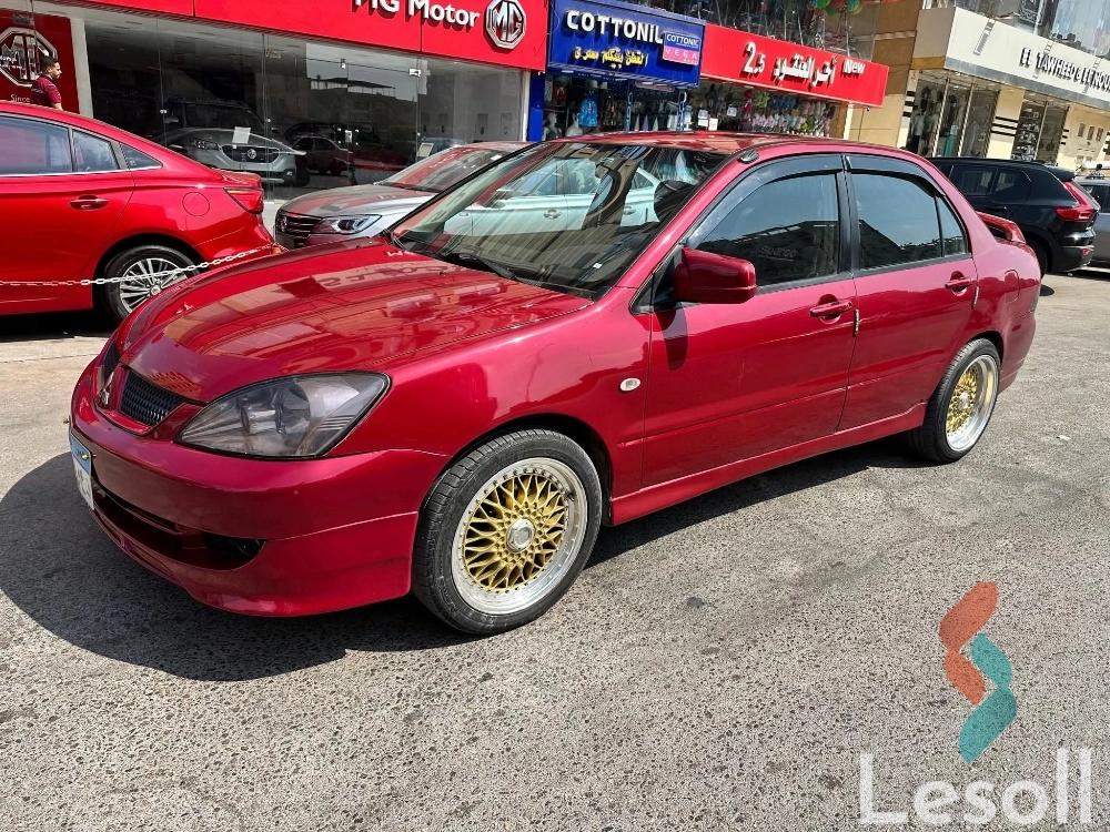 Mitsubishi lancer automatic used maroon model 2005