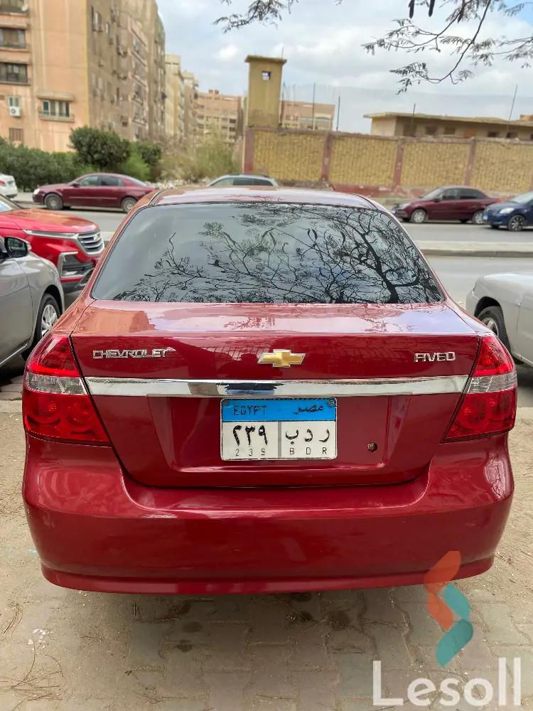 شيفروليه افيو اوتوماتك مستعملة أحمر موديل 2015 - صورة 4